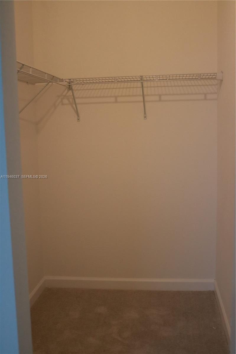 23040 Southwest 99th Court Cutler Bay, FL 33190 - Photo 19 of 23 a view of small space with racks on the wall