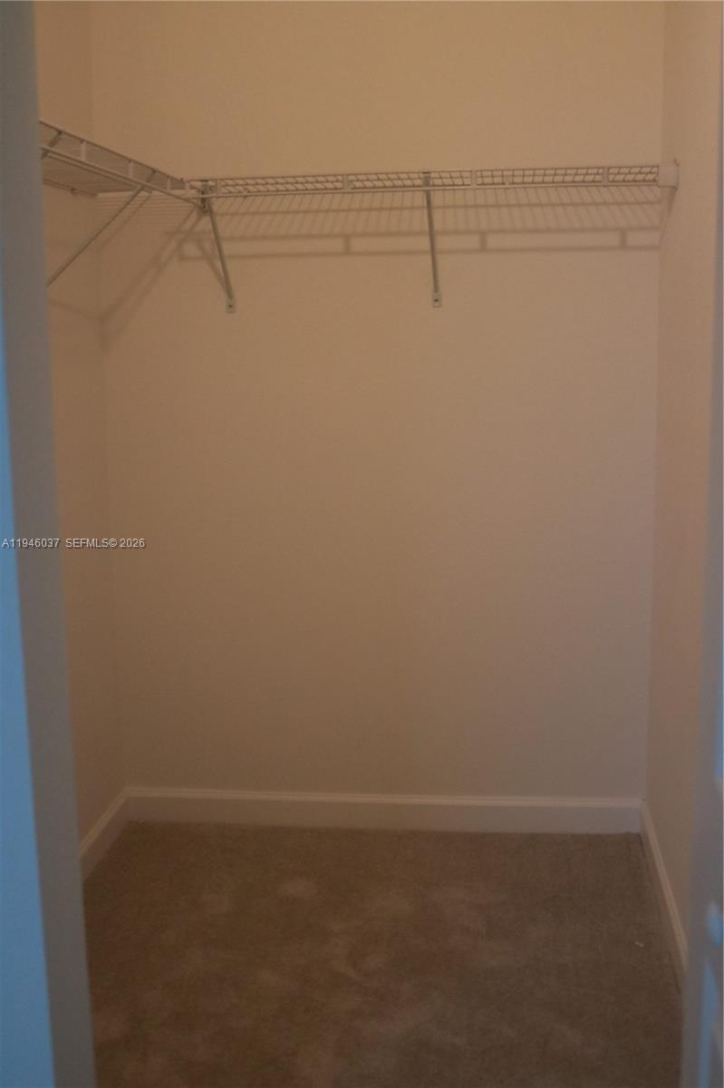 23040 Southwest 99th Court Cutler Bay, FL 33190 - Photo 20 of 23 a view of small space with racks on the wall