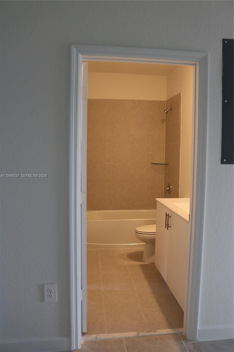 23040 Southwest 99th Court Cutler Bay, FL 33190 - Photo 22 of 23 a bathroom with a toilet and a shower