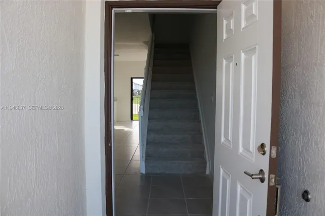 a view of staircase with white walls