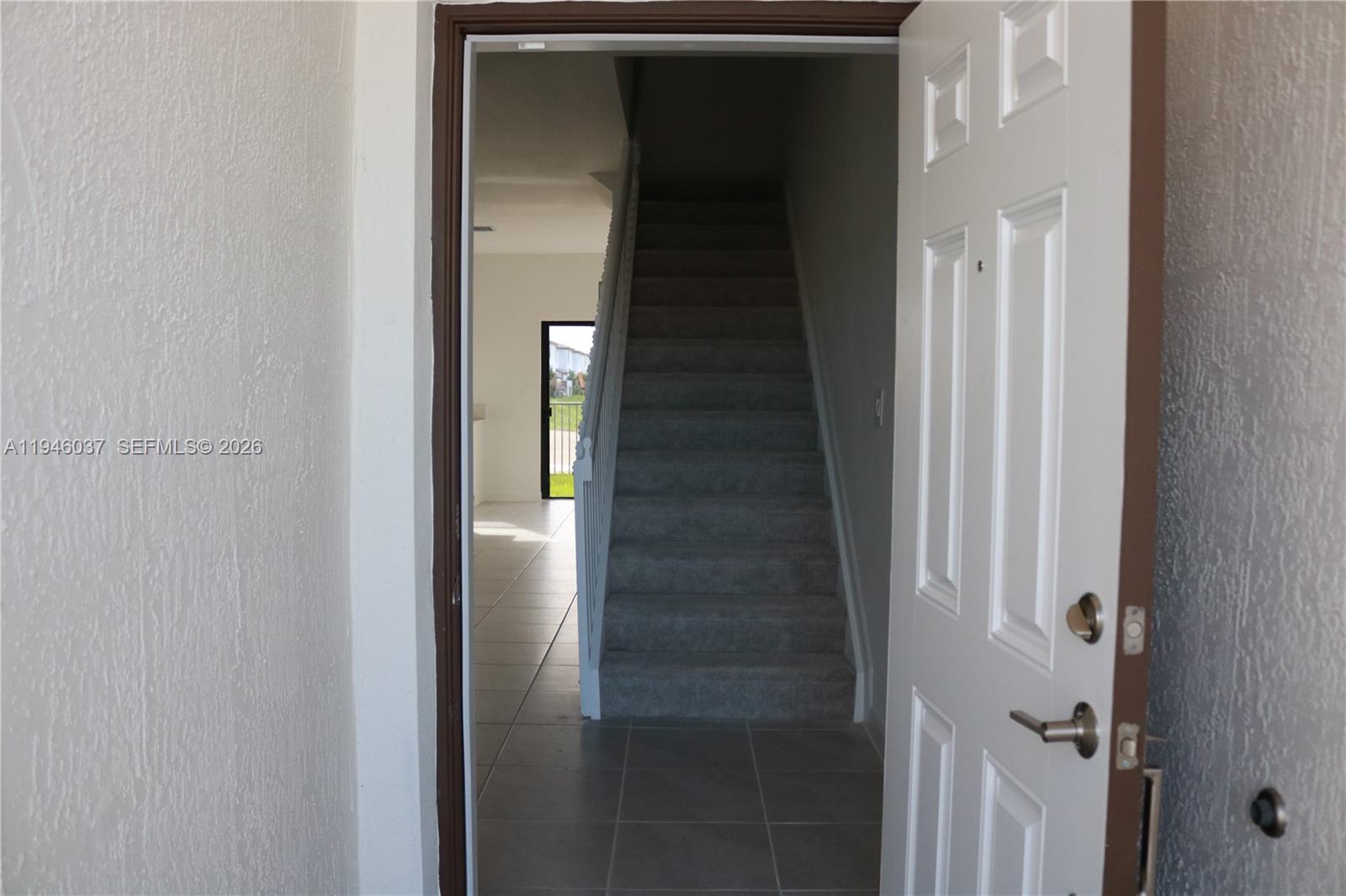 23040 Southwest 99th Court Cutler Bay, FL 33190 - Photo 4 of 23 a view of staircase with white walls