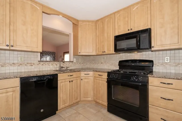 a kitchen with a sink and a refrigerator