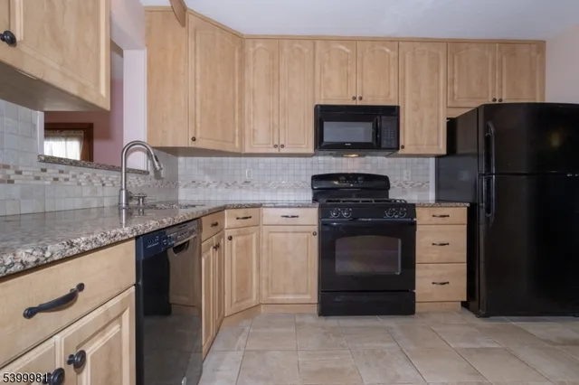 a bathroom with a sink toilet vanity and bathtub
