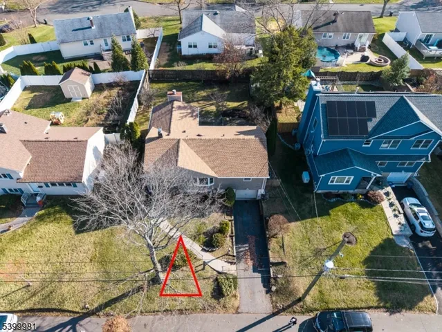 an aerial view of a house with swimming pool