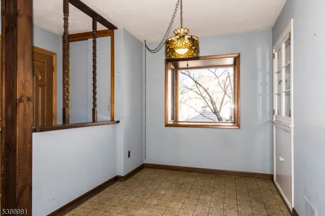 a kitchen with granite countertop a stove top oven microwave and cabinets