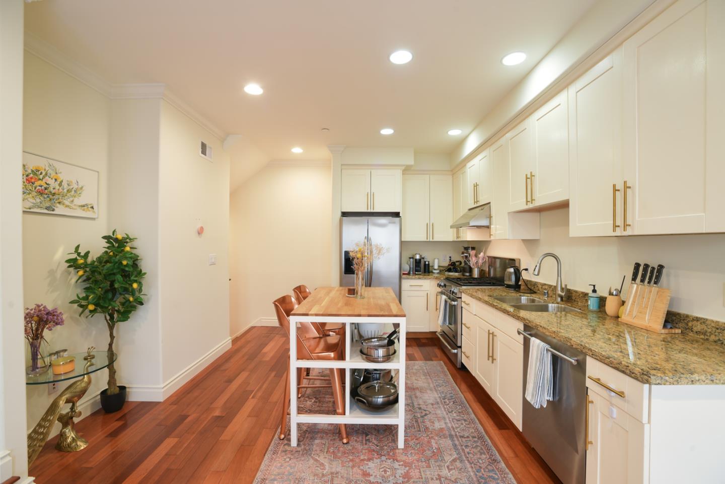 1137 Paloma Avenue, Unit E Burlingame, CA 94010 - Photo 1 of 1 a kitchen with a table and chairs in it