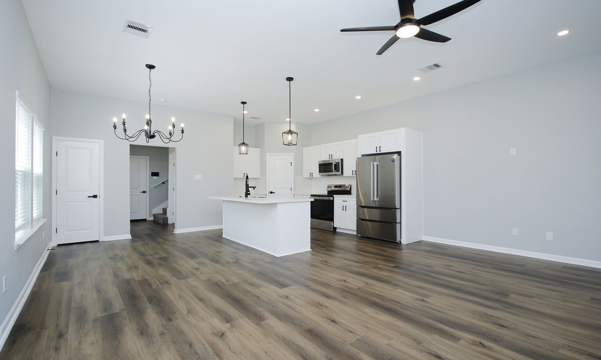 4337 Faulkner Street Houston, TX 77021 - Photo 11 of 39 a view of a kitchen with refrigerator and wooden floor