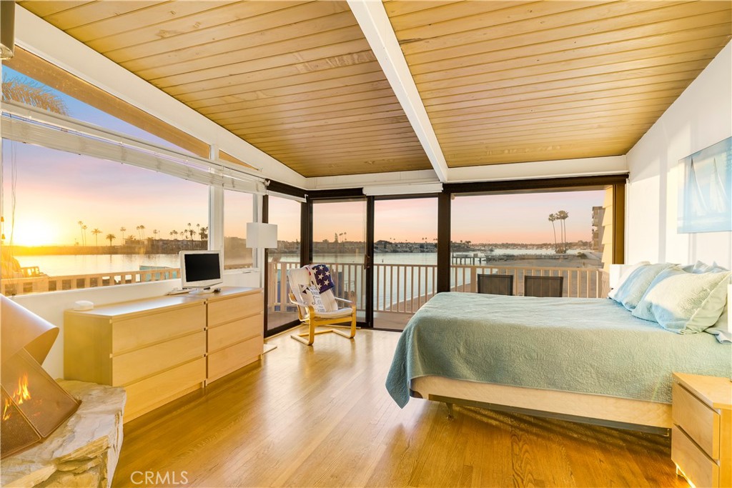 2708 Shell Street Corona del Mar, CA 92625 - Photo 11 of 33 a bedroom with furniture and large windows