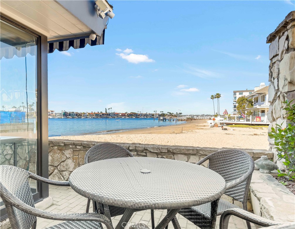 2708 Shell Street Corona del Mar, CA 92625 - Photo 18 of 33 a view of a swimming pool with a table and chairs