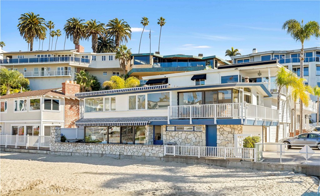 2708 Shell Street Corona del Mar, CA 92625 - Photo 22 of 33 a front view of residential houses with yard and swimming pool