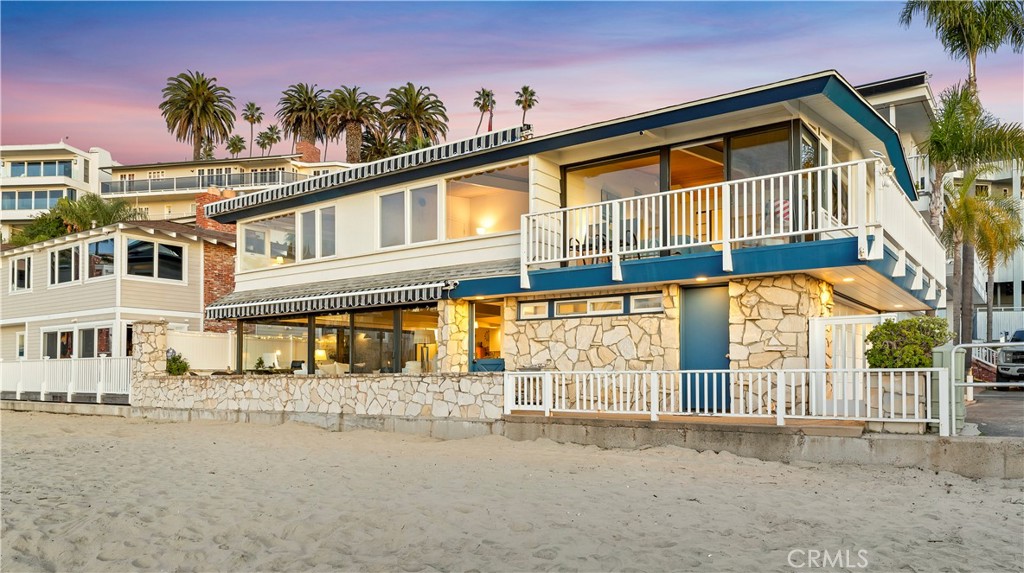 2708 Shell Street Corona del Mar, CA 92625 - Photo 24 of 33 a front view of a building with a garden