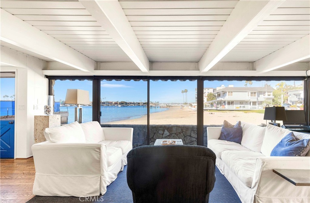 2708 Shell Street Corona del Mar, CA 92625 - Photo 4 of 33 a living room with furniture and large windows