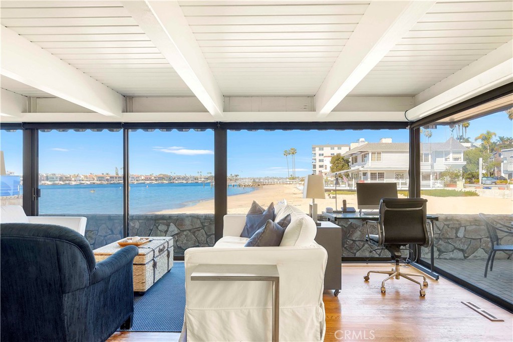 2708 Shell Street Corona del Mar, CA 92625 - Photo 6 of 33 a living room with couches and a large window with garden view