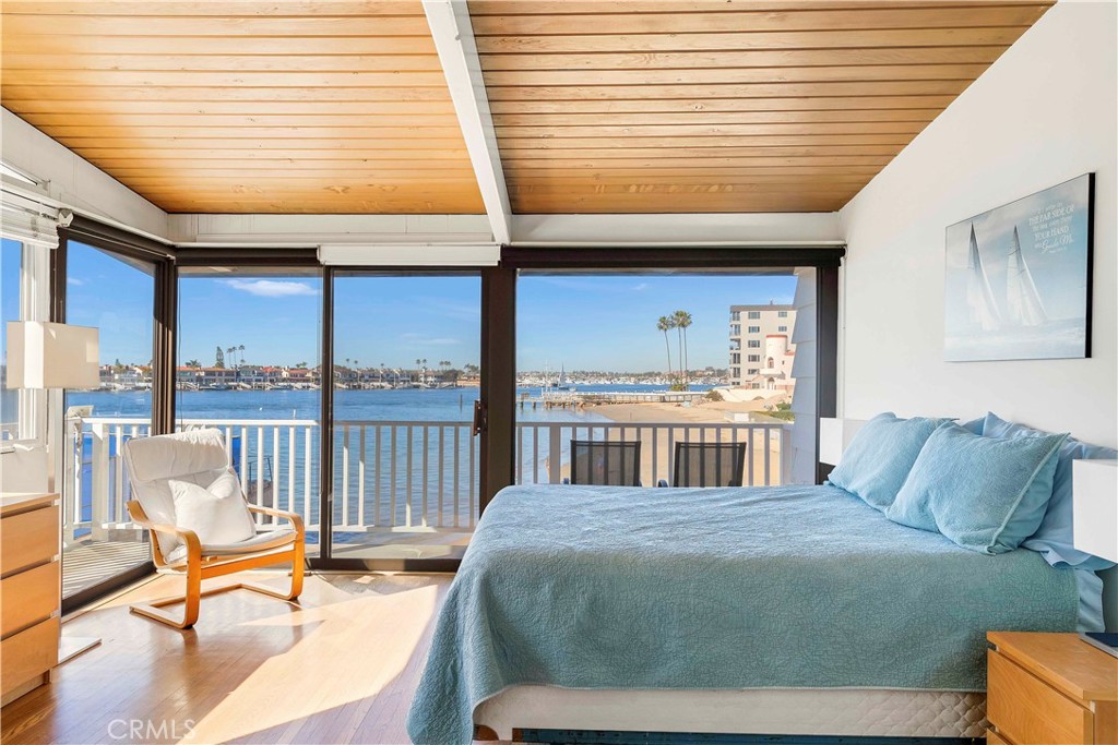 2708 Shell Street Corona del Mar, CA 92625 - Photo 9 of 33 a bedroom with a bed a table and chair