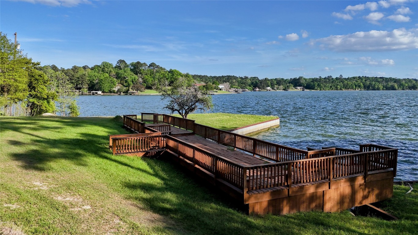 252 Forest Ridge Drive Livingston, TX 77351 - Photo 7 of 13 a view of a chairs in a backyard with wooden fence