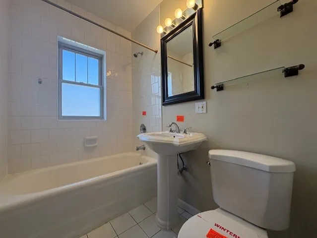 a bathroom with a sink toilet and bathtub