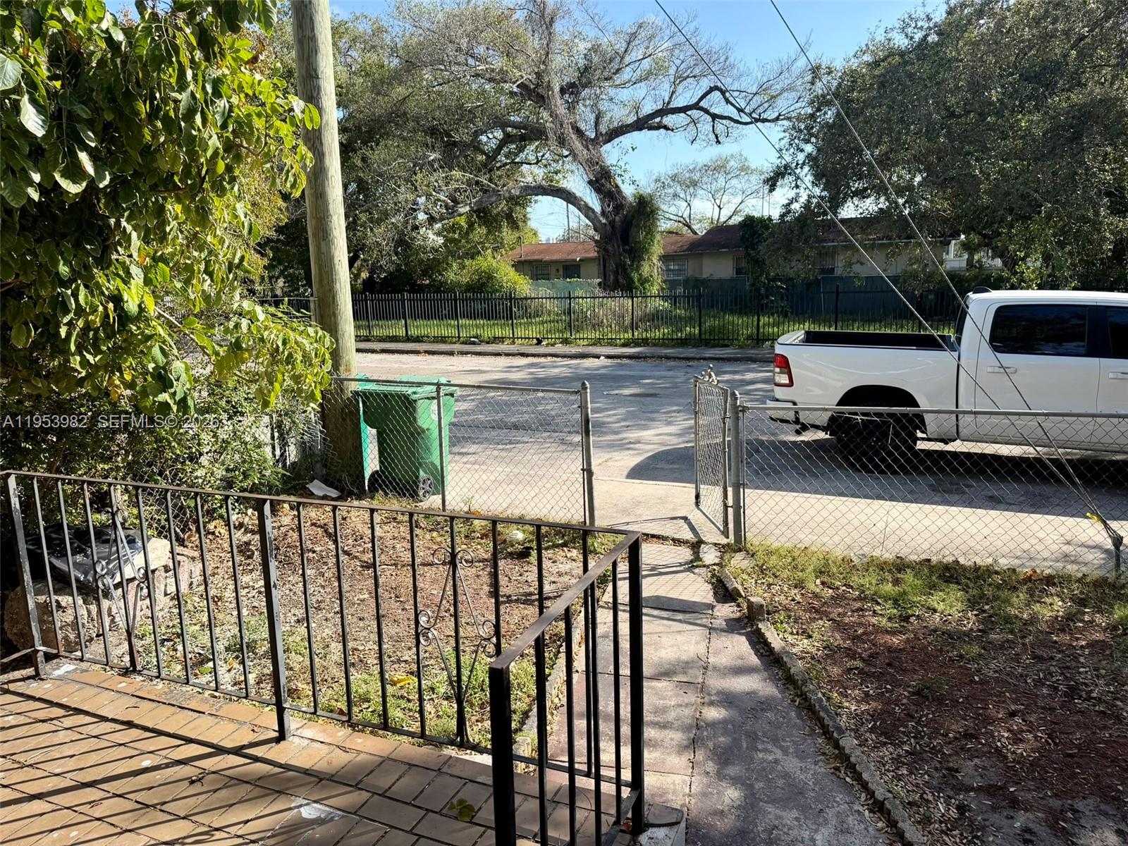 413 Northwest 63rd Street Miami, FL 33150 - Photo 15 of 55 a view of a bench in the side of a park