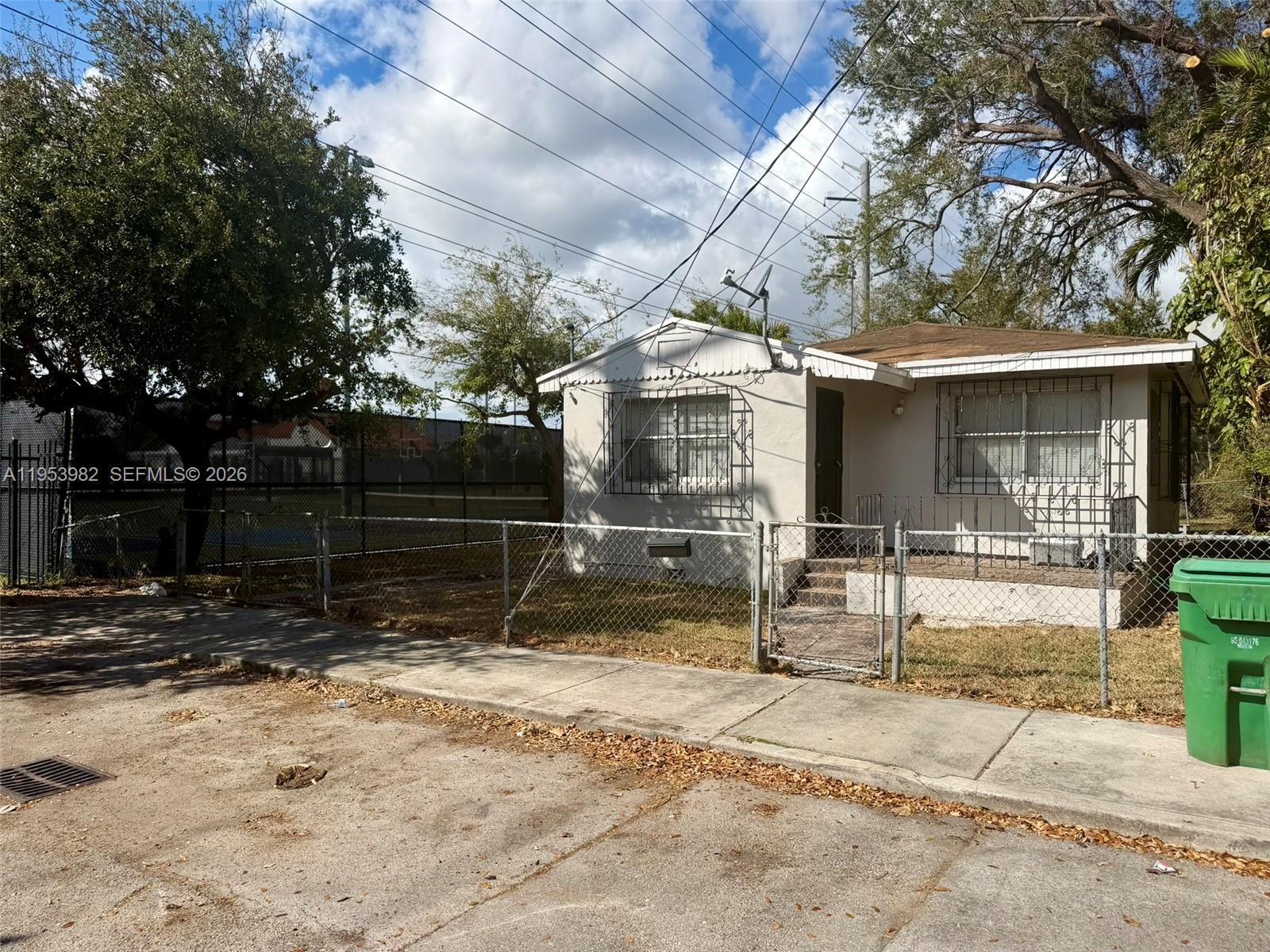 413 Northwest 63rd Street Miami, FL 33150 - Photo 2 of 55 a view of a house with a yard
