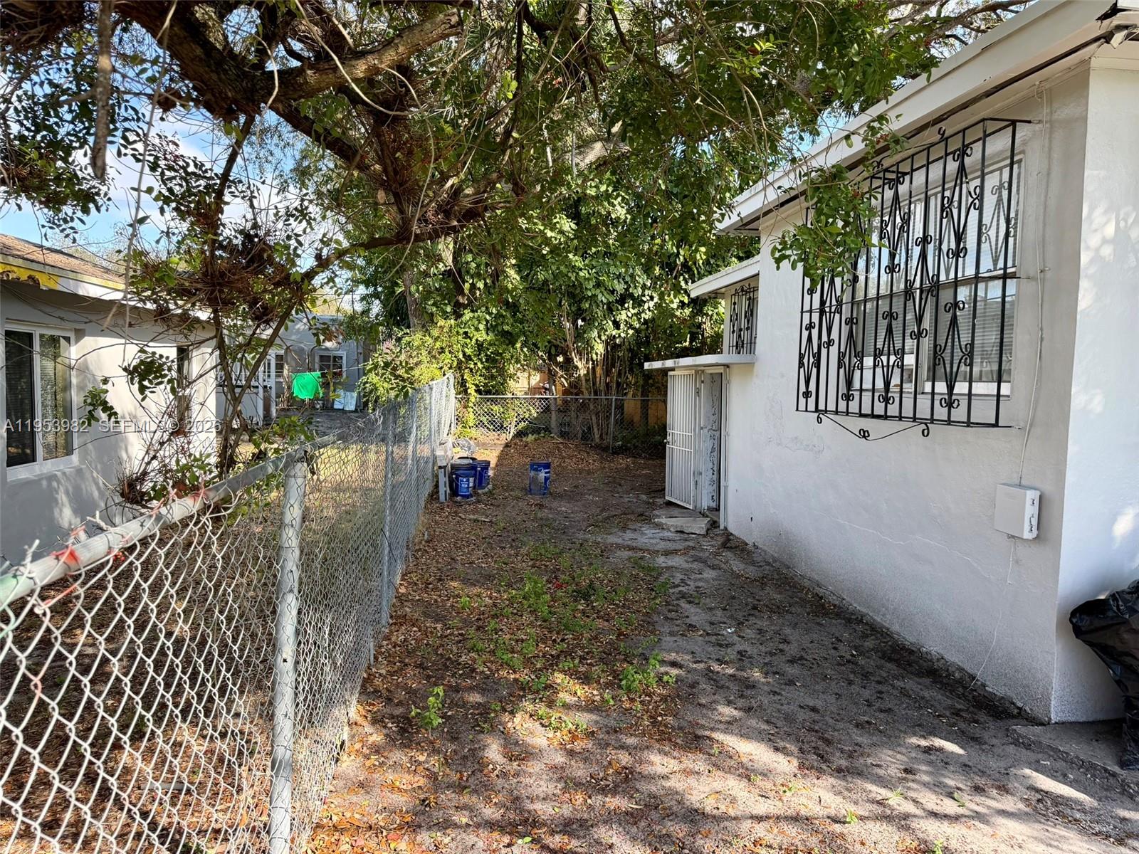 413 Northwest 63rd Street Miami, FL 33150 - Photo 21 of 55 a view of a back yard