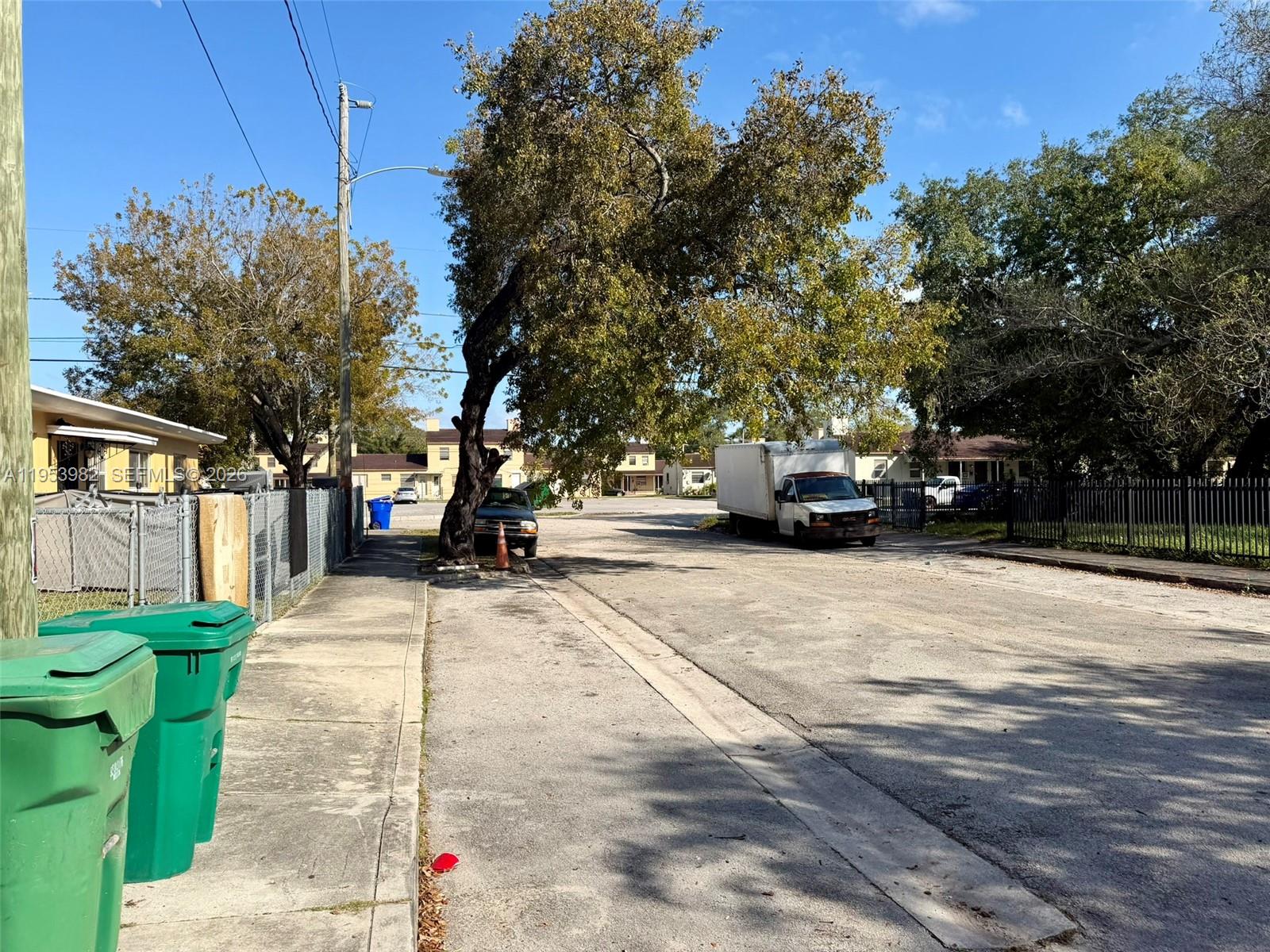 413 Northwest 63rd Street Miami, FL 33150 - Photo 3 of 55 a car parked on the side of a street