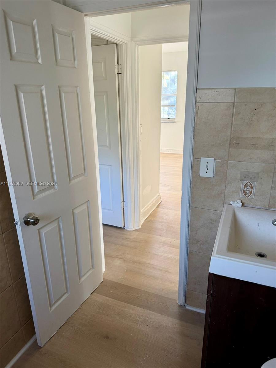 413 Northwest 63rd Street Miami, FL 33150 - Photo 41 of 55 a bathroom with a sink and mirror