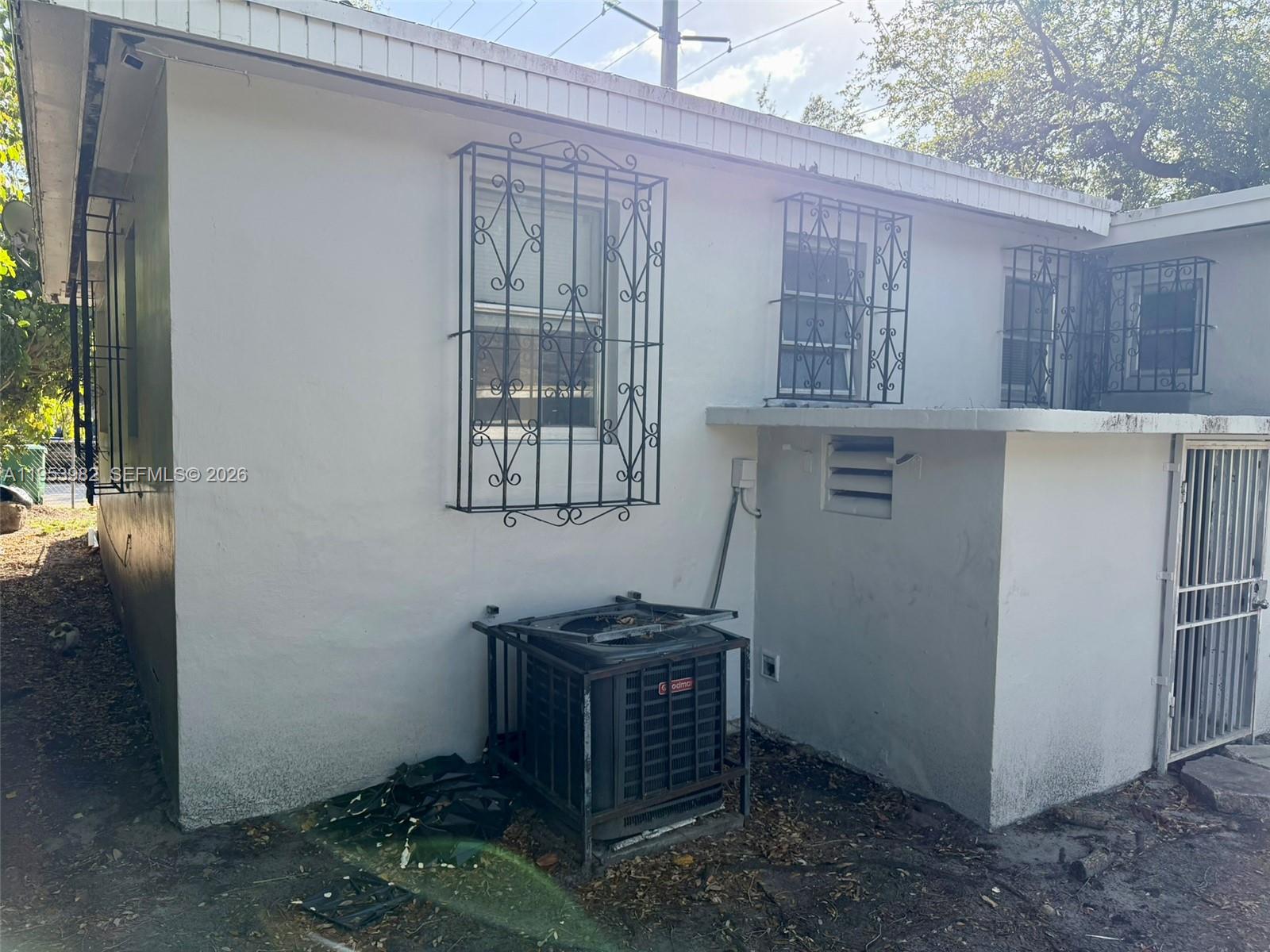 413 Northwest 63rd Street Miami, FL 33150 - Photo 53 of 55 a room with a table and a chair