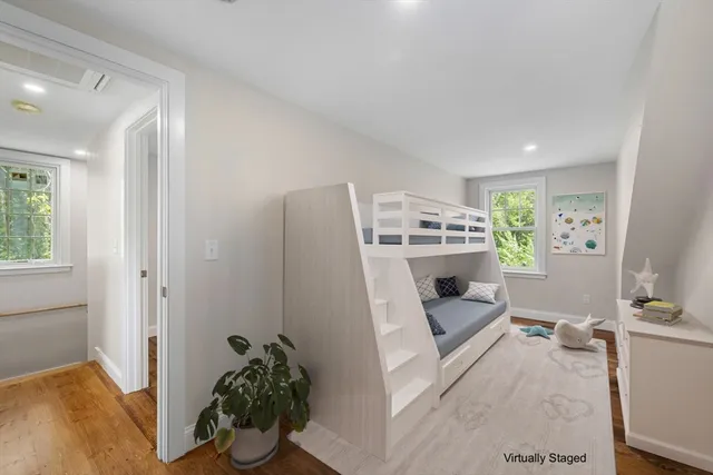 a view of a livingroom with furniture and workspace