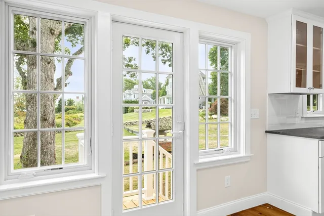 a view of a room that has a window and a kitchen