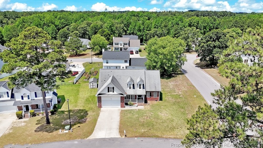 10 Pender Road Spring Lake, NC 28390 - Photo 31 of 35 an aerial view of a house with a garden and lake view