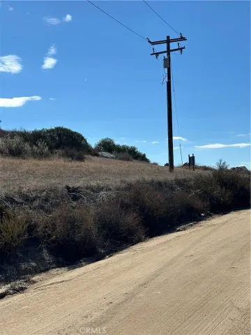 a view of a mountain range with trees in the background