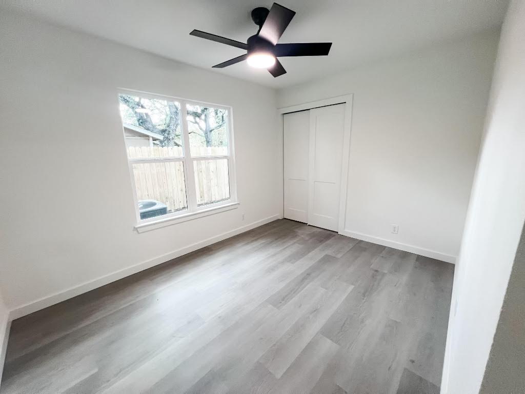 5013 Cana Cove, Unit A Austin, TX 78749 - Photo 19 of 28 a view of empty room with wooden floor and fan