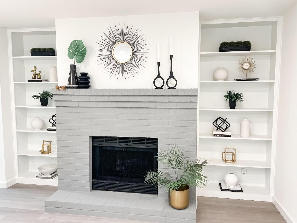 5013 Cana Cove, Unit A Austin, TX 78749 - Photo 9 of 28 a kitchen with a refrigerator a fireplace and wooden floor