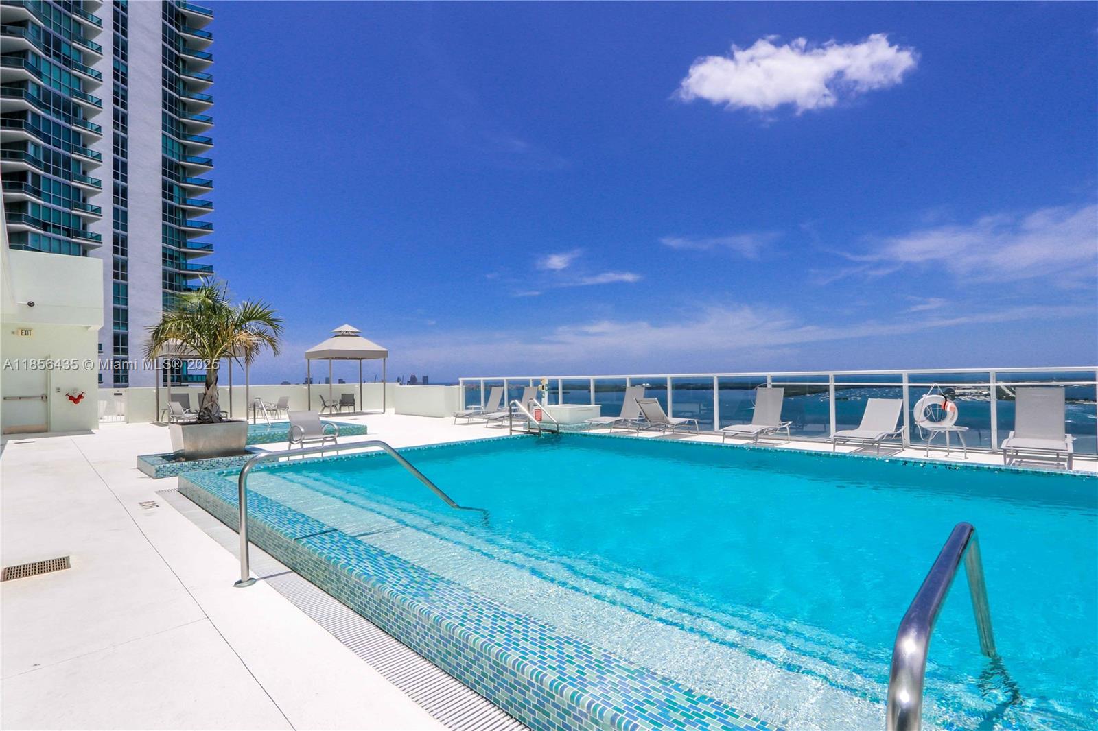 218 Southeast 14th Street, Unit 1406 Miami, FL 33131 - Photo 17 of 19 a view of a house with swimming pool