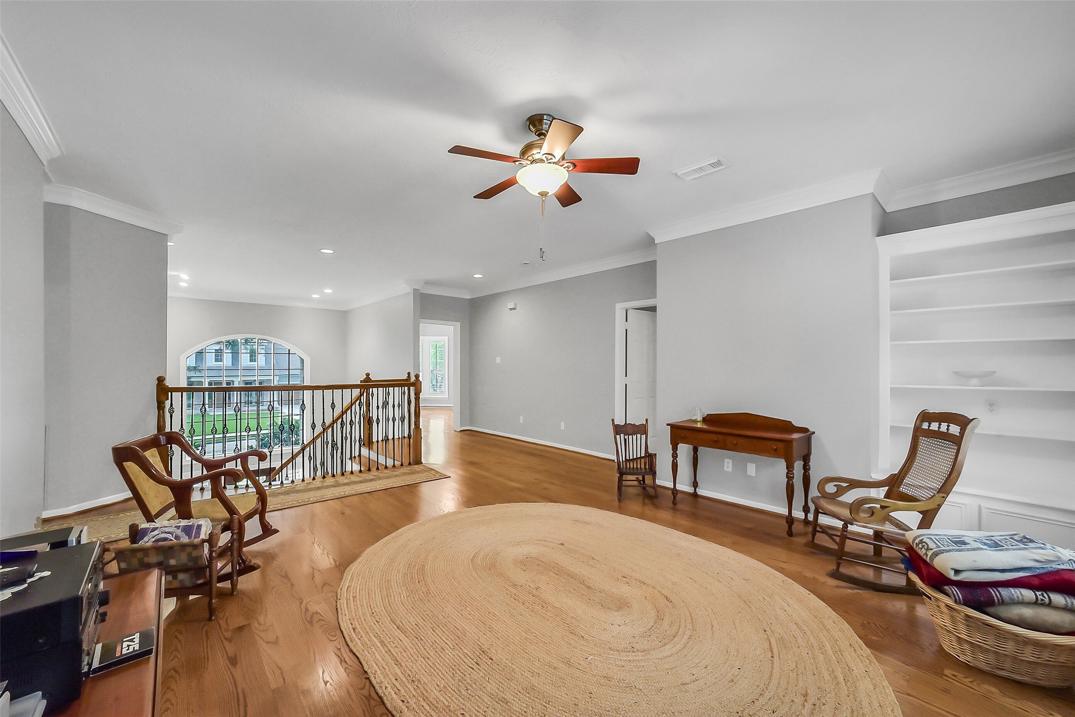 1260 Fries Road Houston, TX 77055 - Photo 25 of 42 Wide open Game Room at the Top of the Stairs complete with custom wood floors through 2nd Story