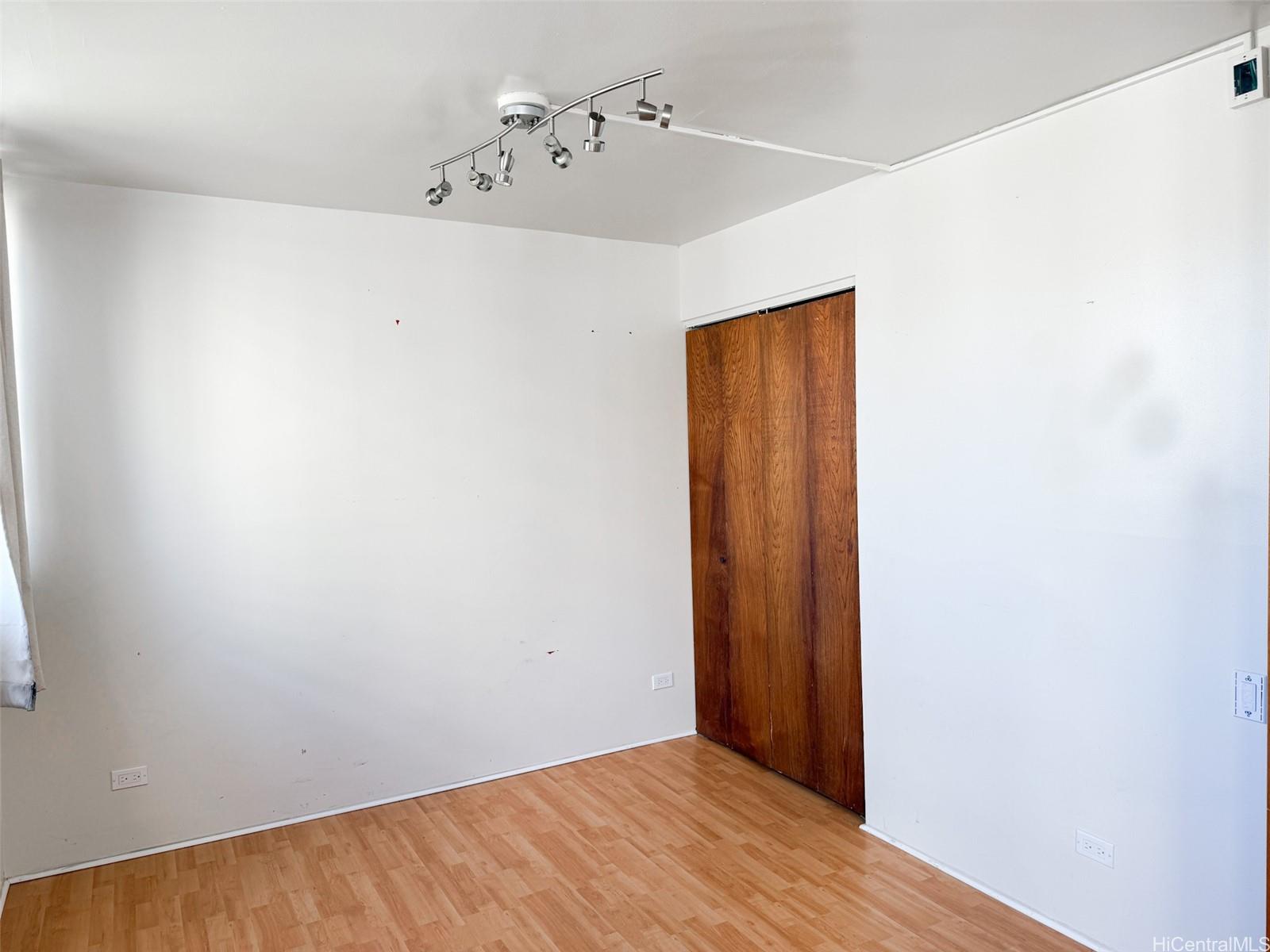1134 Kinau Street, Unit 607 Honolulu, HI 96814 - Photo 4 of 10 a view of a room with wooden floor