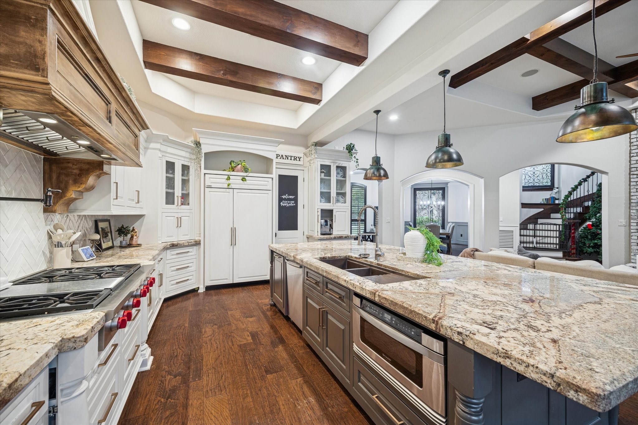 4114 Tee Tree Court Spring, TX 77386 - Photo 7 of 38 a kitchen with stainless steel appliances granite countertop a stove and a sink