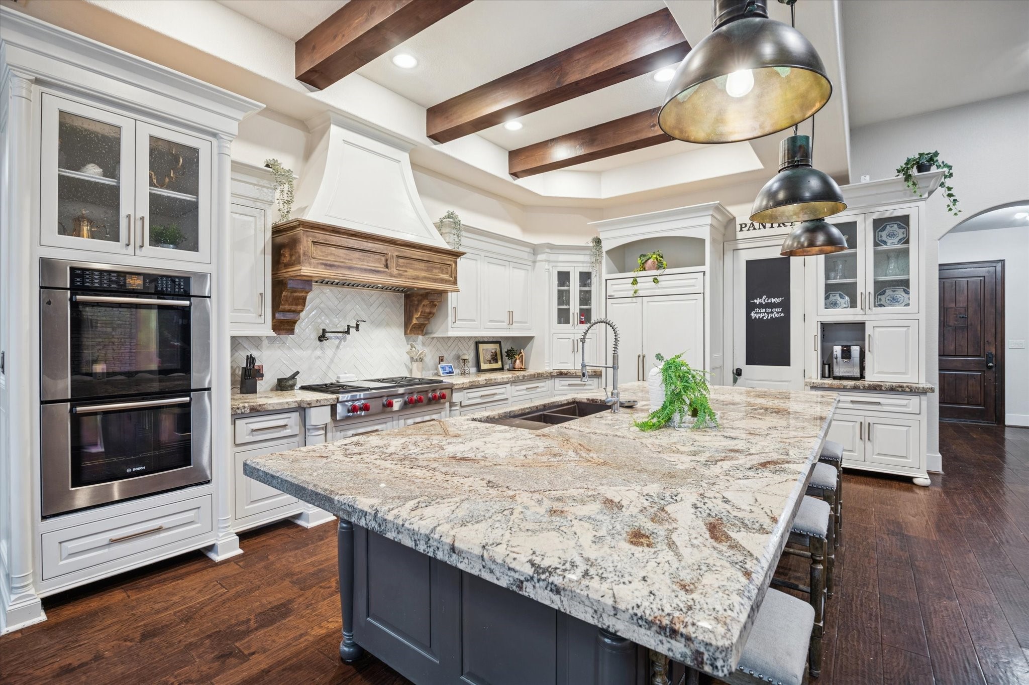 4114 Tee Tree Court Spring, TX 77386 - Photo 8 of 38 a kitchen with a stove and a wooden floors