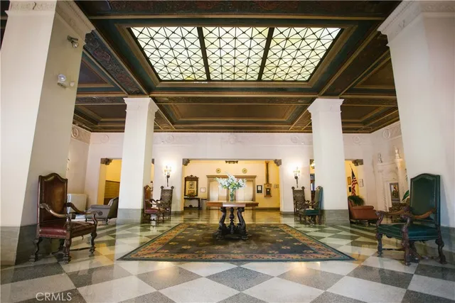 a living room with lots of tables and chairs