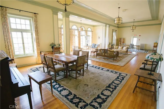 a view of a balcony with two chairs and a potted plant