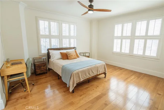 a bedroom with a bed chair and window