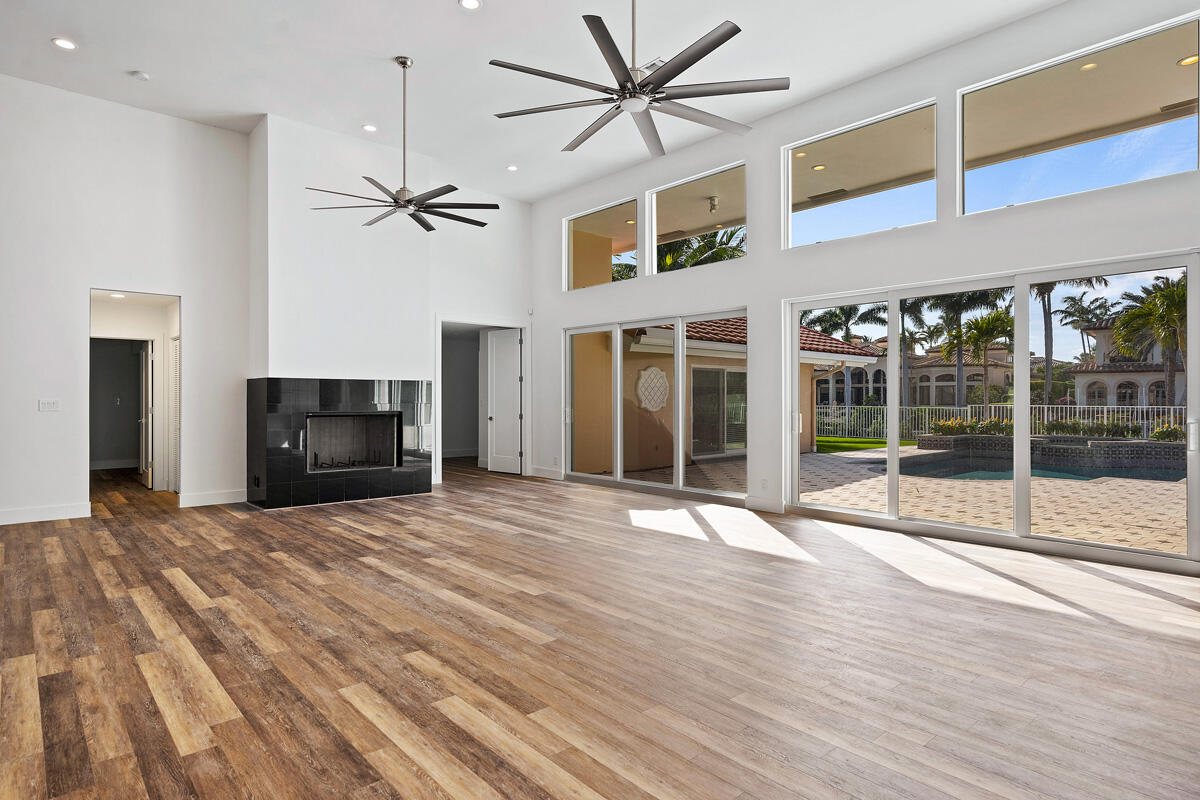 533 East Alexander Palm Road Boca Raton, FL 33432 - Photo 15 of 44 a view of empty room with wooden floor and fan