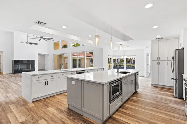 a kitchen with stainless steel appliances granite countertop a stove and a sink