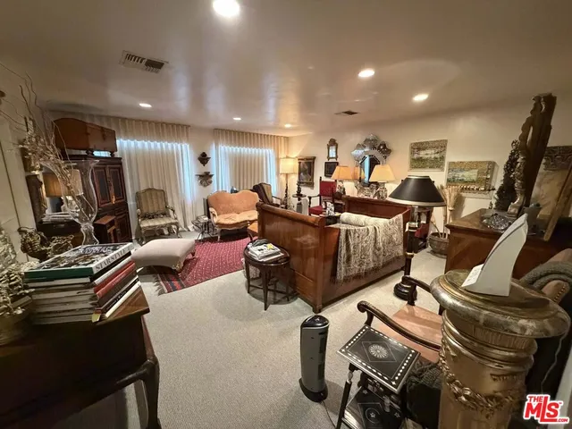 a room with gym equipment and a flat screen tv