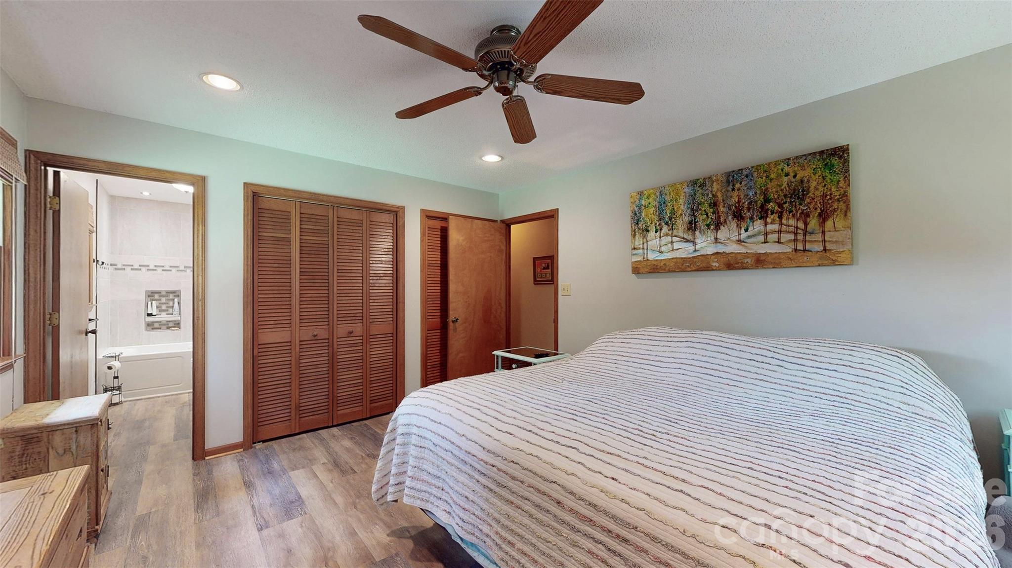 8720 Unionville-Brief Road Monroe, NC 28110 - Photo 33 of 35 a bedroom with a bed and a painting on the wall