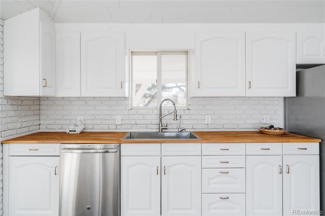 a kitchen with a stove and cabinets