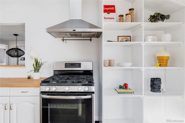 a bedroom with a bed and flat screen tv