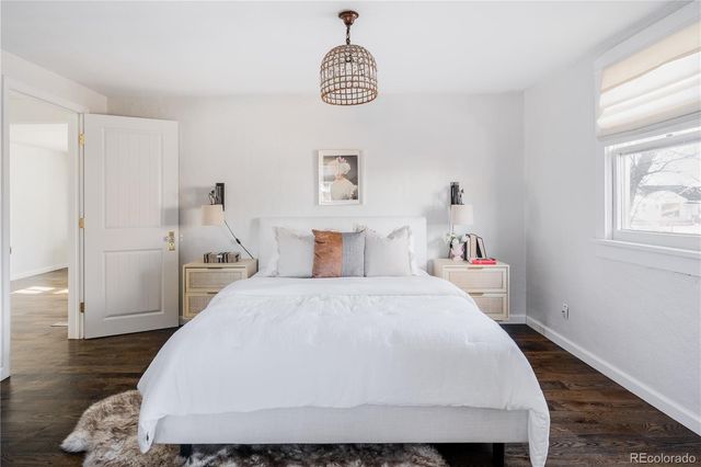 a work room with furniture wooden floor and window