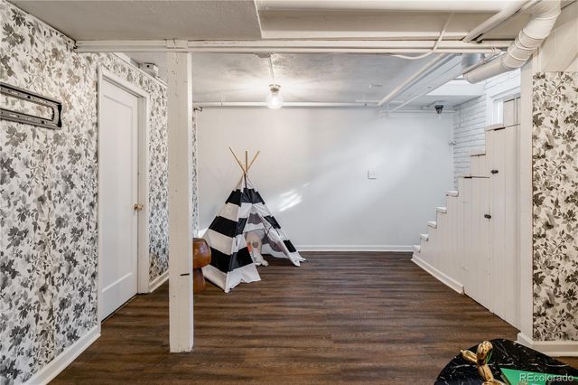 a bed room with a bed and a night stand