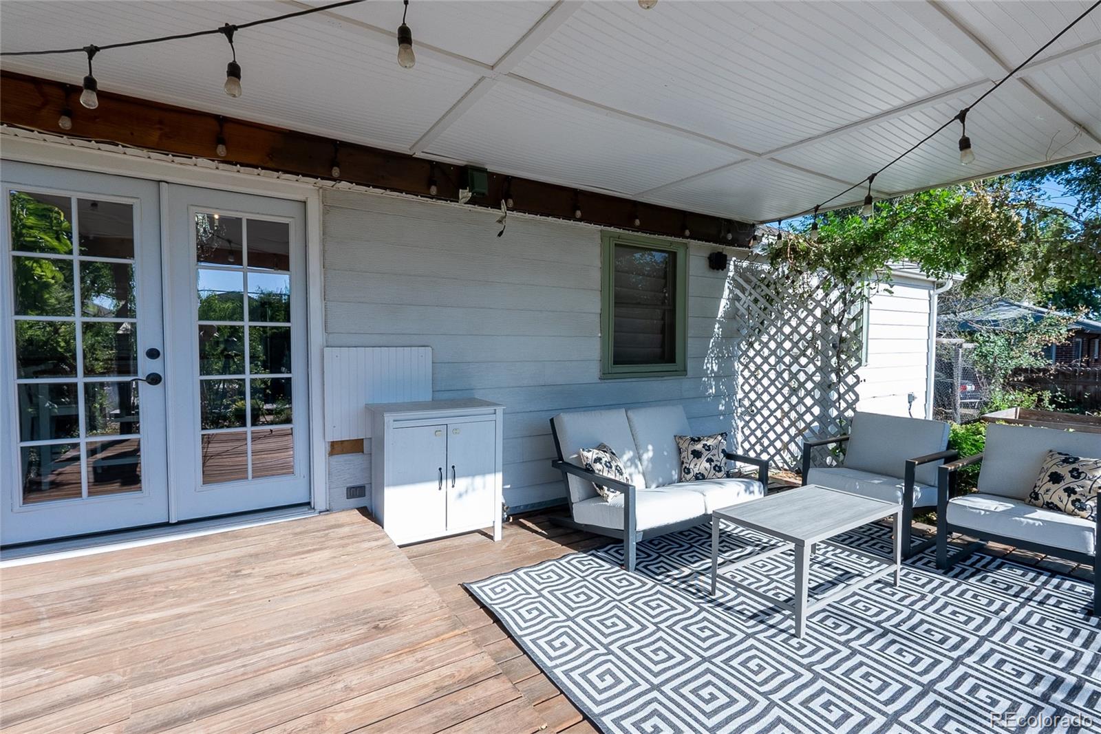 3940 Quay Street Wheat Ridge, CO 80033 - Photo 27 of 28 a outdoor living space with furniture and a rug