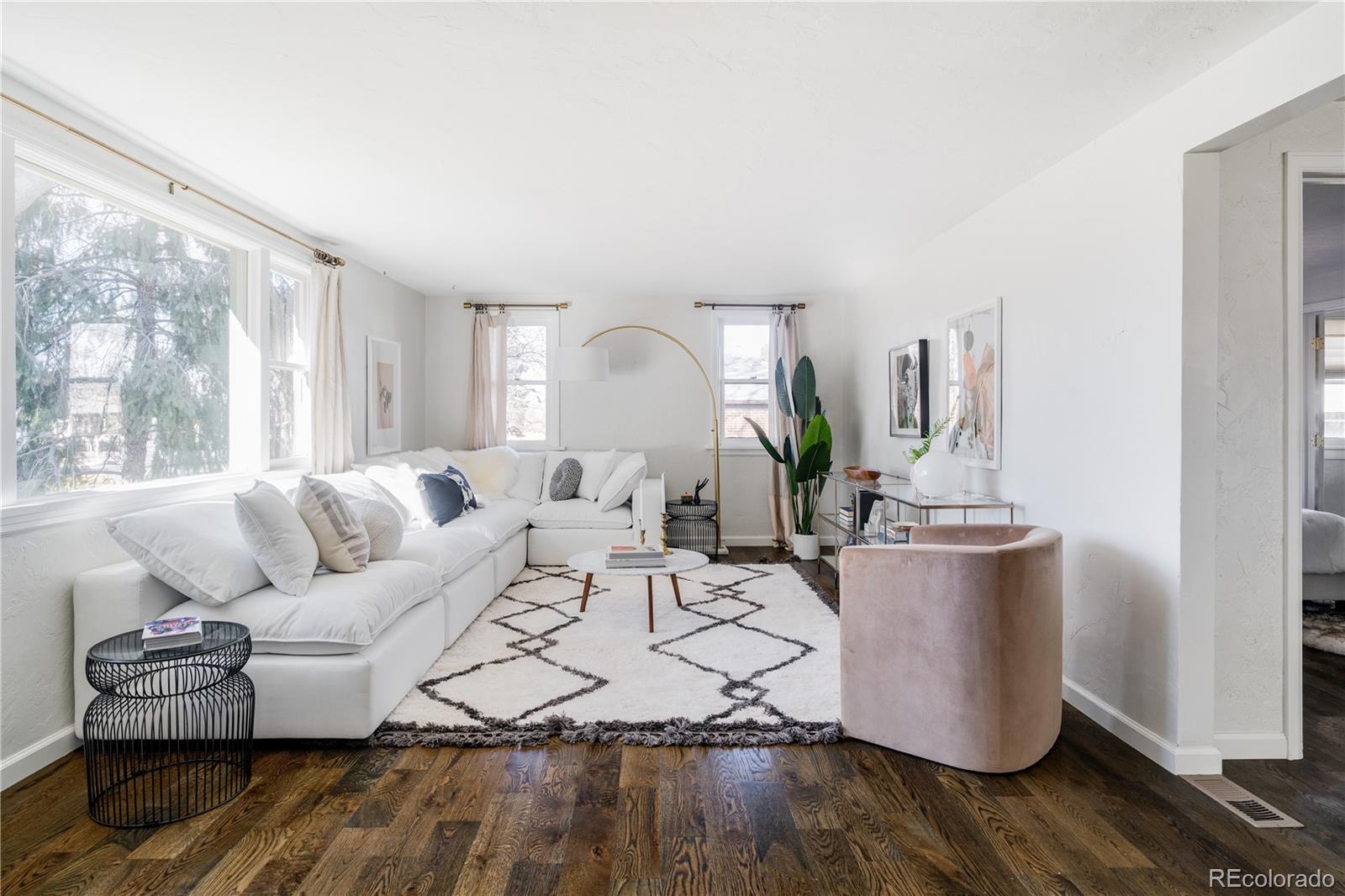 3940 Quay Street Wheat Ridge, CO 80033 - Photo 6 of 28 a living room with furniture and a wooden floor